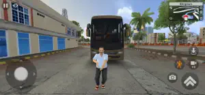 The driver standing beside his coach outside the depot