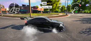A black coupé drifting with smoke past a lawn, a 152-point drift multiplier on screen