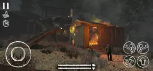 A burning shack beside the tracks at night