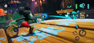 Mickey spraying thinner across a wooden bridge toward a blue Blotling