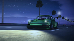 A green sports car parked on a coastal road at dusk