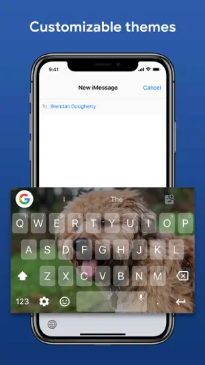 Gboard custom theme on iPhone using a photo of a curly-haired dog behind translucent keys