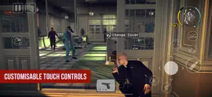 47 taking cover behind a crate in a warehouse with a change-cover prompt, captioned customisable touch controls