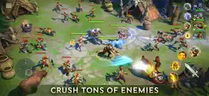 A team cutting through a crowd of goblins on a grassy field, captioned crush tons of enemies