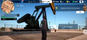 A pumpjack nodding behind a chain-link fence with the objective to wait for the first barrel
