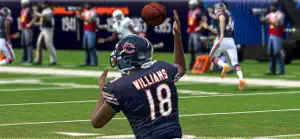 Quarterback releasing a pass with a receiver downfield