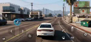 White sedan driving through a low-rise suburb with the mini-map and touch controls on screen