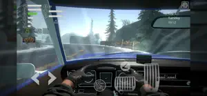 Driver's view of the dashboard and steering wheel on a snowy forest road, Tuesday clock top right
