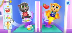 Two characters seated on toilets with coins collected above