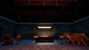 The museum's red-lit lobby with a reception desk, exhibit stands and a striped predator statue