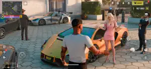 A gold supercar and a silver coupe parked beside a woman in a pink suit on a sunlit street