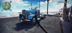 Blue semi-truck at a coastal fuel stop with palm trees behind