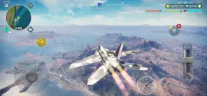 Fighter jet banking above a desert plateau