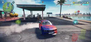 Red sports car drifting past a petrol station with smoke off the rear tyres