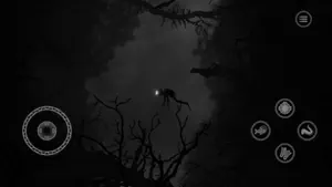 The diver swimming through a forest of black branches lit by a single light