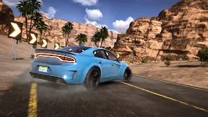 Blue muscle car sliding past yellow chevron signs beneath red cliffs and palms