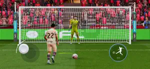 A penalty run-up against a goalkeeper under floodlights with a pink-lit crowd