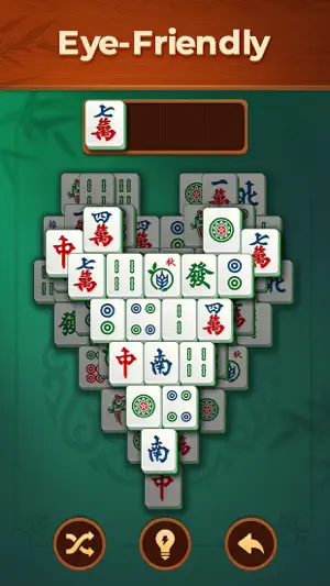 Heart-shaped tile layout on a green table with one character tile in the tray, captioned 'Eye-Friendly'